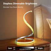 Spiral table lamp with stepless dimmable brightness on a wooden surface.